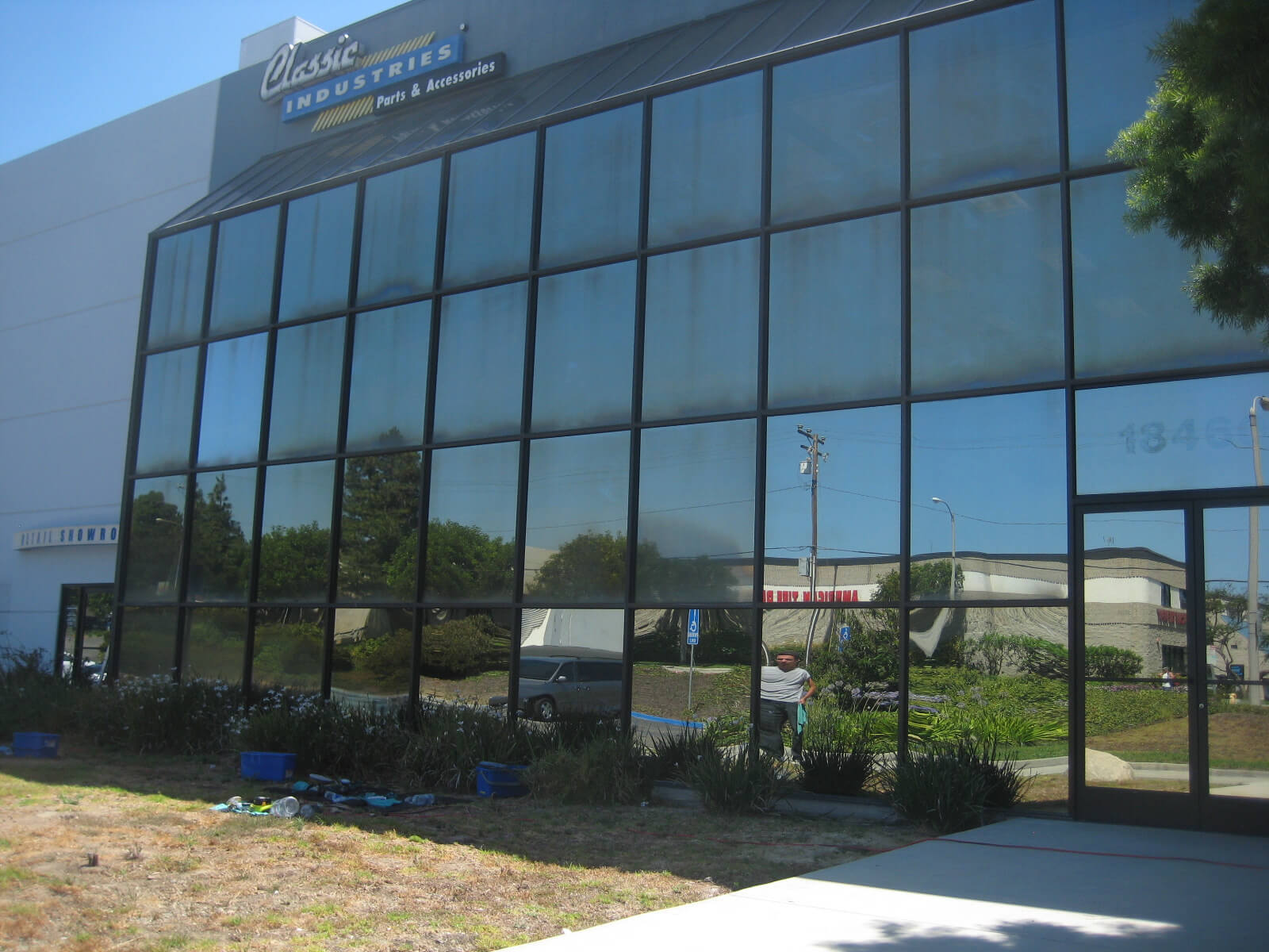 This is how performance glass, or exterior reflective glass, looks when neglected for years. Huntington Beach, CA
