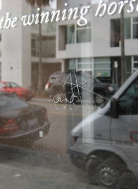 Scratched Glass Graffiti Removal - Before Grinding