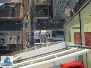 Shangri-La Toronto glass scratch removal - aerial view looking straight down glass curtainwall from 20th floor balcony