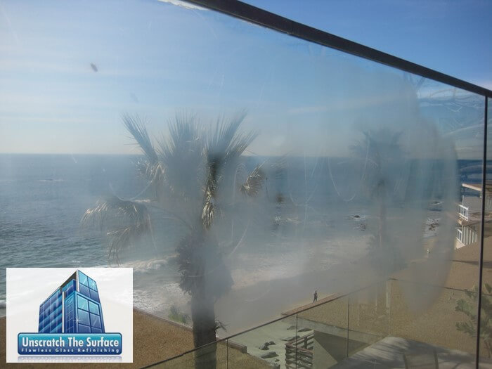 Can graffiti scratches be cleaned off of glass? Must grind and polish to remove glass scratches in Laguna Beach, CA