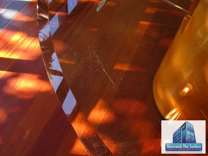 Remove Scratches from Glass Table | Bel Air CA Closeup of glass scratches in table top near bevel before resurfacing. Bel Air, CA