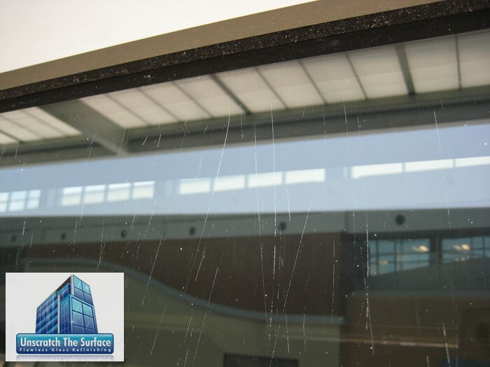 Widespread Glass Scratch Refinishing closeup before fixing widespread scratched glass - Biloxi, MS