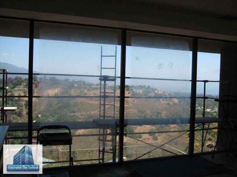 Mountains thru scratched glass view.