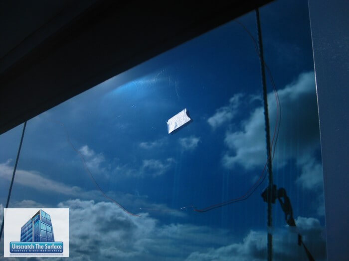 Removing haze from incompletely polished glass at Disney Hotel in Anaheim, CA