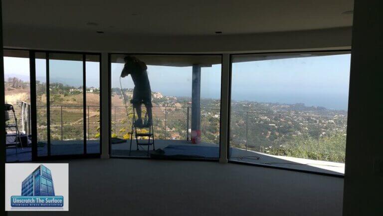 Glass scratch repair technician working on Santa Barbara custom home
