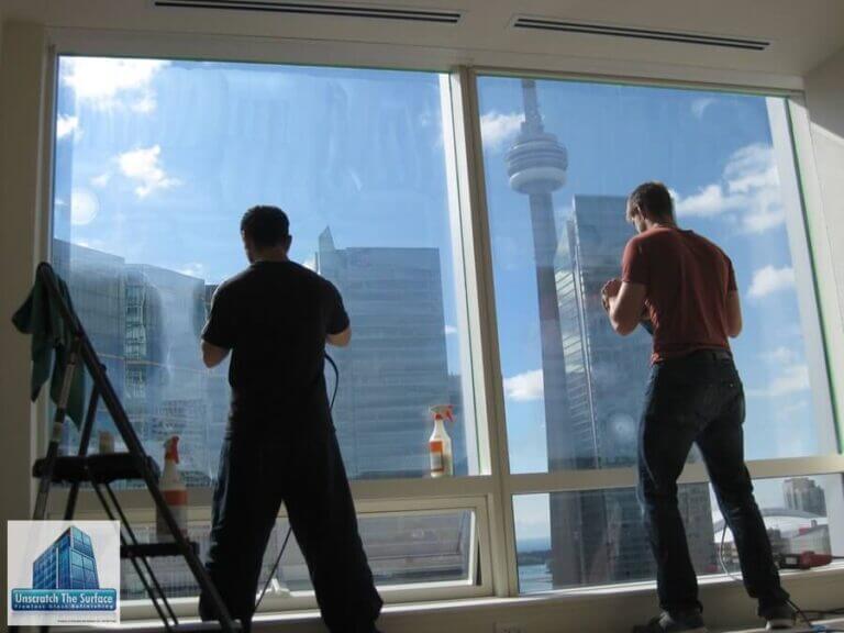 Glass Scratch Removal Toronto Canada - Commercial High-rise one more is, adam and rob polishing large view window with cn tower in view