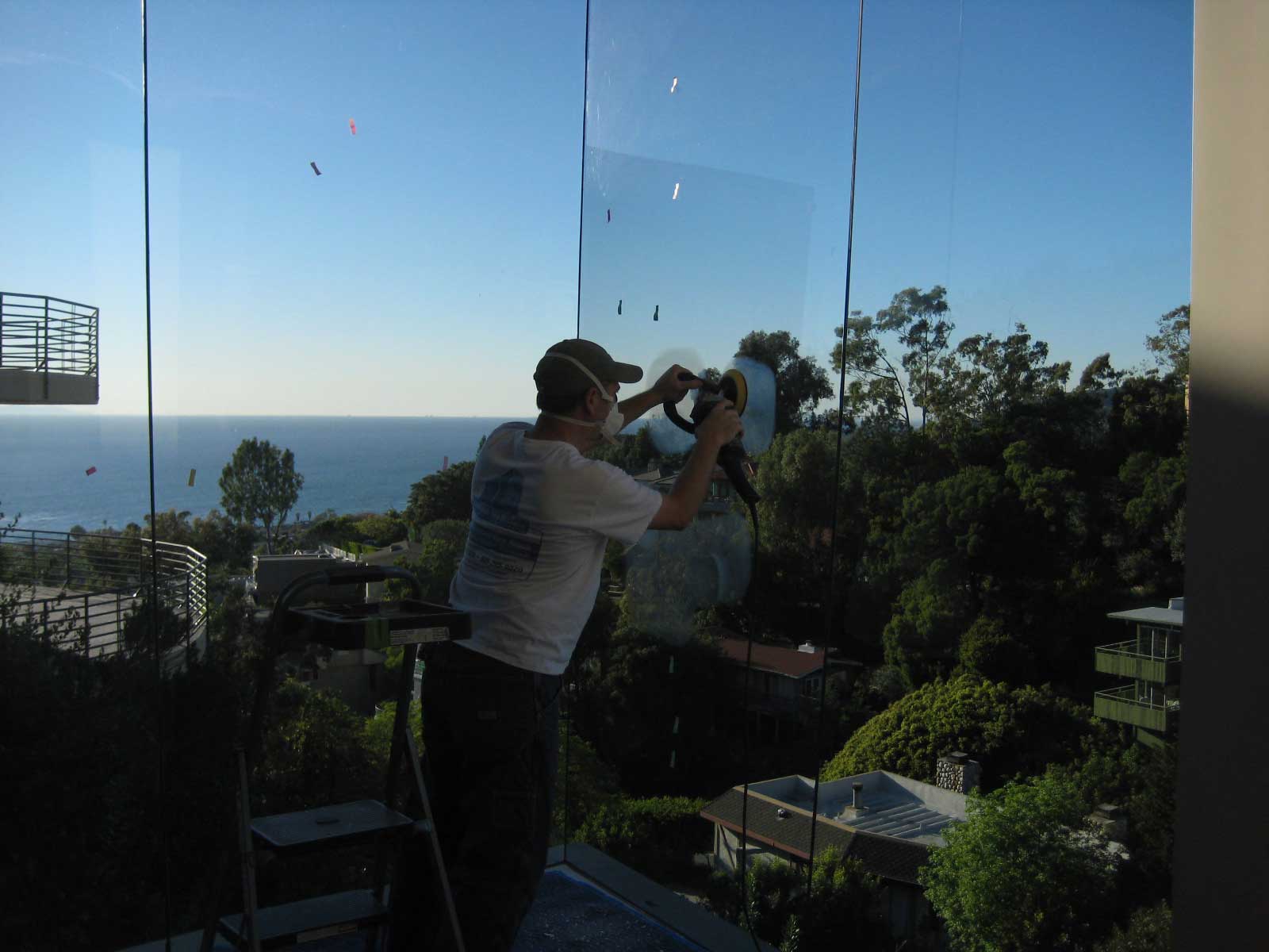 Restoring vs. Replacing: The Economical and Sustainable Choice for Scratched Glass Ocean view while getting scratches out of glass in Laguna Beach, CA.