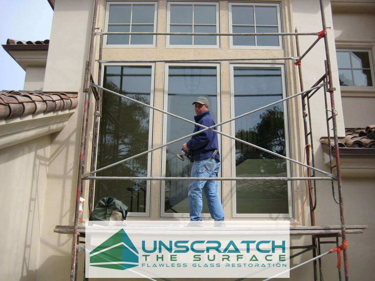 Scratch Removal and Restoration: How to Remove Scratches from Glass thru Refinishing Rick Evans on scaffolding in Carmel CA