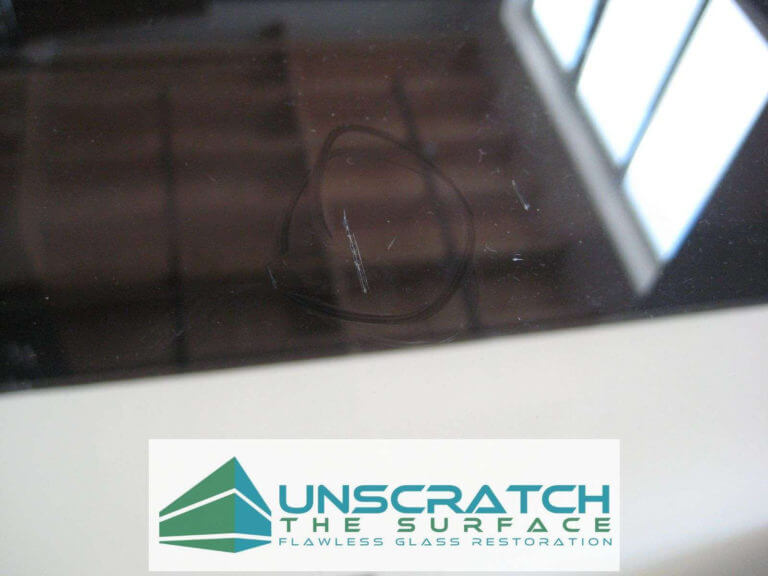 Closeup of scratch in laminated glass floor