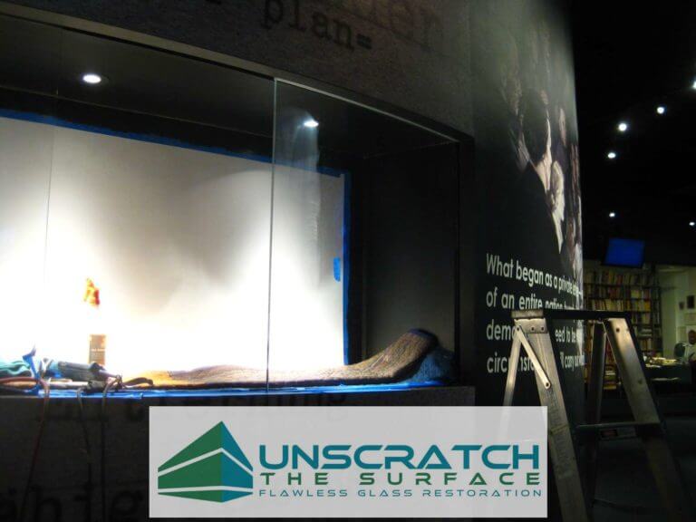 Curved Glass Scratch Removal Los Angeles CA View of scratched curved glass going into wall.